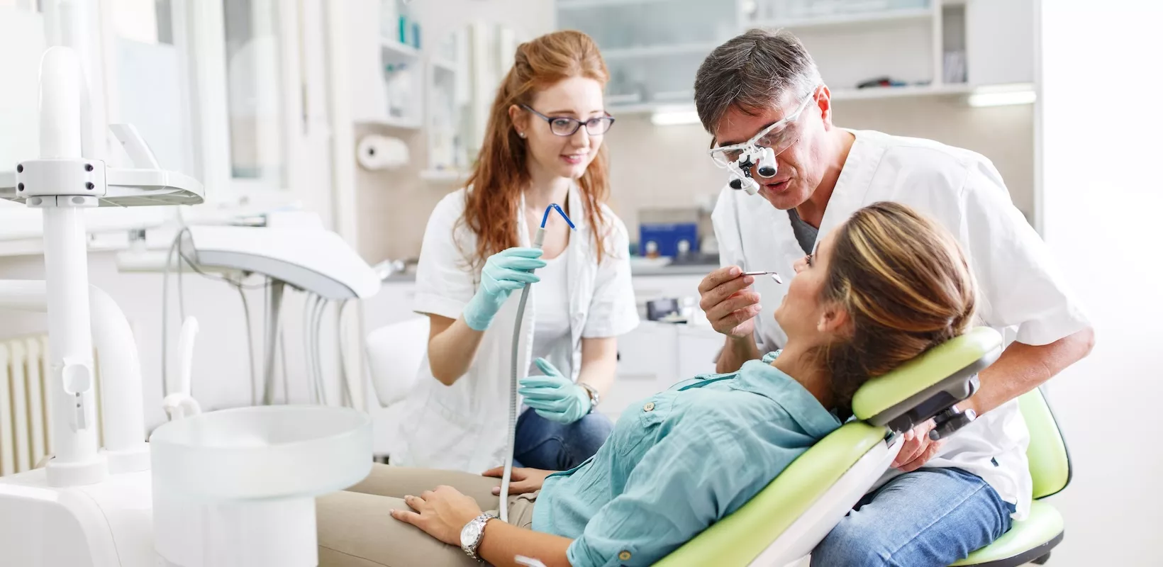 periodontal maintenance featured image of a patient in a dental exam chair